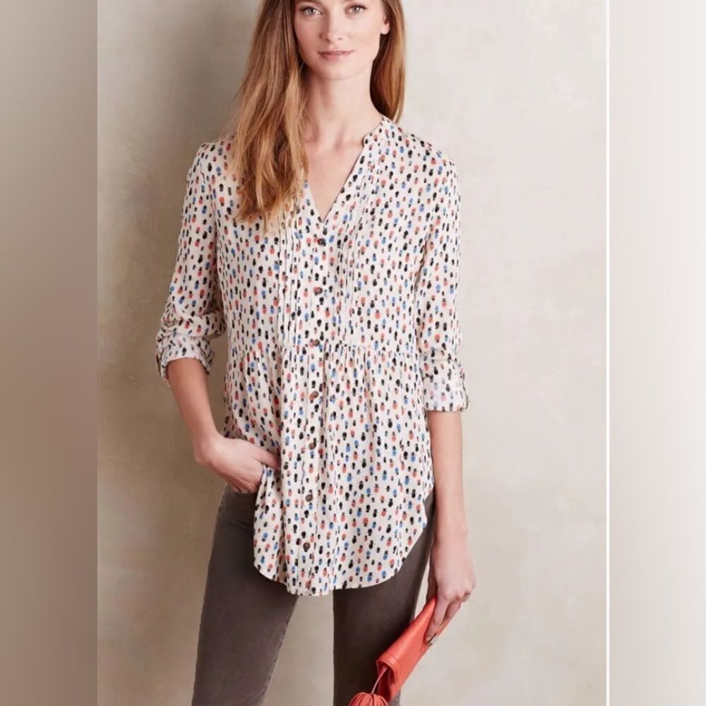 Maeve (Anthropologie) button front tuxedo pleat empire waist long sleeve shirt.